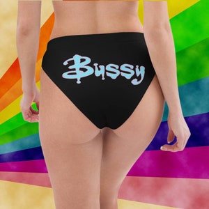 May include: Black underwear with a blue and white graphic that says "Bussy" on the back.