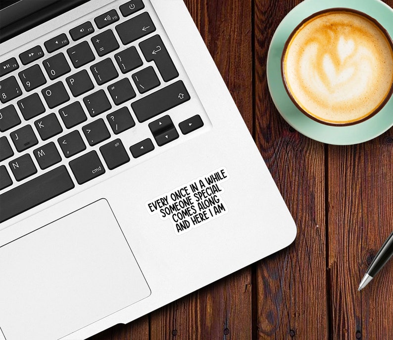 May include: A white laptop computer with a black keyboard and a sticker on the right side that says "Every once in a while someone special comes along and here I am."