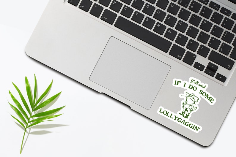 May include: A green sticker on a laptop with a cartoon cowboy and the text "Y'all mind if I do some lollygaggin'"