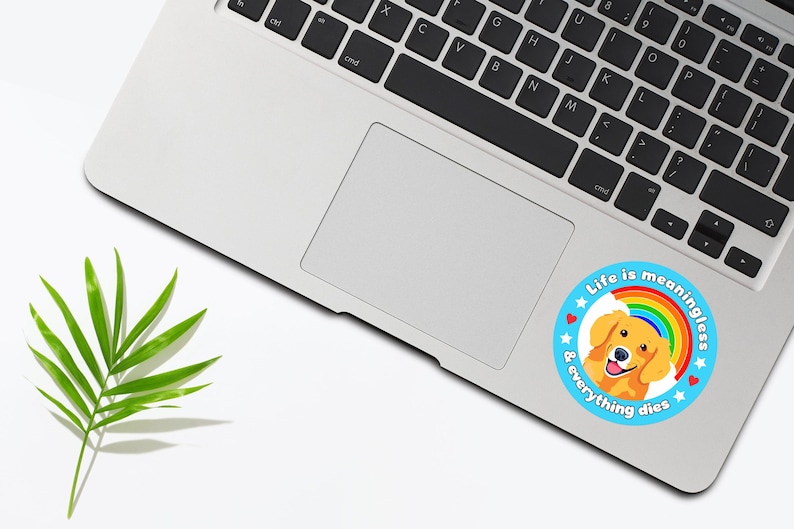 Puede incluir: Una pegatina azul y blanca con un arco&iacute;ris y un cachorro golden retriever. La pegatina dice "La vida no tiene sentido y todo muere".
