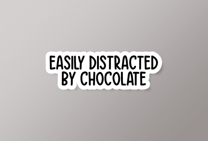 May include: White sticker with black text that reads "Easily Distracted by Chocolate".