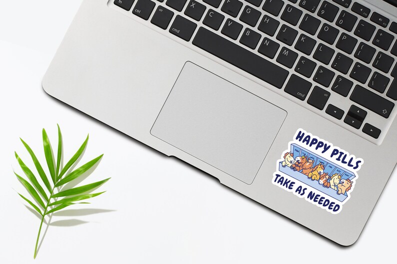 May include: A sticker with a cartoon illustration of a pill dispenser filled with happy cartoon animals. The text reads "Happy Pills Take as Needed".