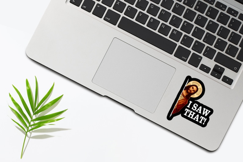 May include: A sticker featuring a picture of Jesus peeking around a corner with the text "I SAW THAT!" printed below.