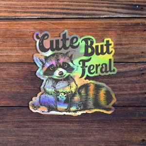 Cute But Feral Raccoon Vinyl Sticker, Sarcastic Snarky Funny Sticker, Adult Humor, Waterproof Sticker Decal Holographic Vinyl