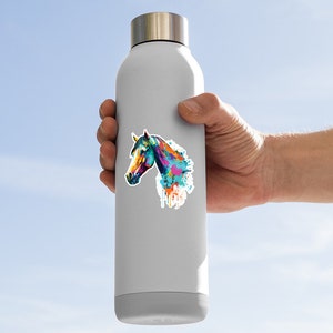 May include: A stainless steel water bottle with a colorful watercolor horse head sticker. The horse is painted in shades of blue, green, yellow, orange, and pink.