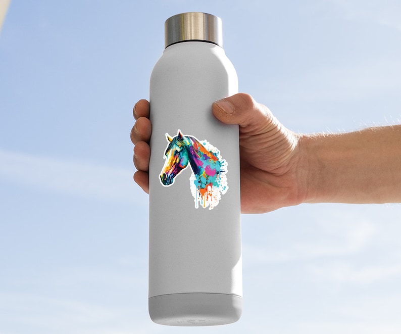 May include: A stainless steel water bottle with a colorful watercolor horse head sticker. The horse is painted in shades of blue, green, yellow, orange, and pink.