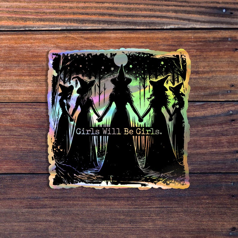 May include: A holographic sticker featuring a silhouette of four witches in a forest setting. The witches are holding hands and the text "Girls Will Be Girls." is printed below them.