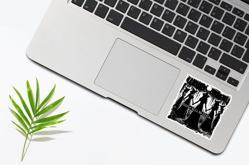 May include: Black and white sticker featuring a group of three witches in a forest setting. The text "Girls Will Be Girls" is printed below the witches.