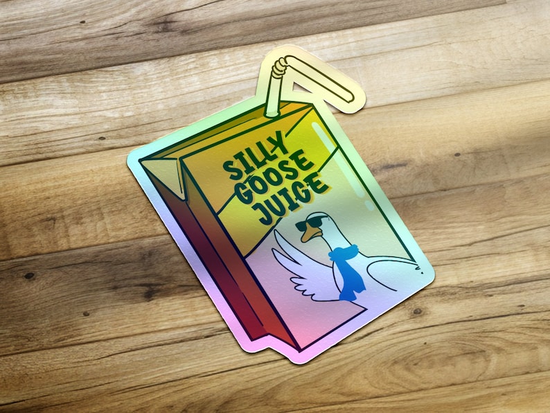Puede incluir: Una pegatina hologr&aacute;fica de un ganso de dibujos animados con gafas de sol y una bufanda azul, con el texto "Silly Goose Juice" en una caja de jugo amarilla y marr&oacute;n.