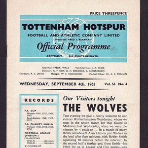 May include: A black and white program for a football match between Tottenham Hotspur and Wolverhampton Wanderers. The program is dated September 4th, 1963. The program includes a list of records for Tottenham Hotspur, including their wins in the FA Cup, FA Charity Shield, and Football League.