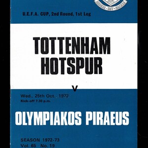 May include: A blue and white programme for a football match between Tottenham Hotspur and Olympiacos Piraeus. The programme is from the 1972-73 season and features the Tottenham Hotspur crest. The text reads "OFFICIAL PROGRAMME, price 5p, U.E.F.A. CUP, 2nd Round, 1st Leg, Tottenham Hotspur, V, Wed., 25th Oct., 1972, Kick-off 7.30 p.m., Olympiacos Piraeus, SEASON 1972-73, Vol. 65 No. 19".