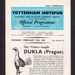 May include: A black and white illustration of a rooster on a soccer ball. The text "Our Visitors tonight DUKLA (Prague)" is printed in black on a white background. The text "PRICE THREEPENCE" is printed in black on a white background. The text "TOTTENHAM HOTSPUR FOOTBALL AND ATHLETIC COMPANY LIMITED" is printed in black on a blue background. The text "Official Programme" is printed in black on a blue background. The text "MONDAY, FEBRUARY 26th, 1962 Vol. 54 No. 37" is printed in black on a white background.