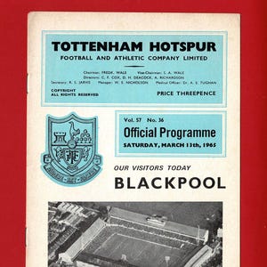 May include: A vintage Tottenham Hotspur football program from March 13, 1965, featuring an aerial view of the stadium and the visiting team, Blackpool. The cover includes the club's crest and details about the match.