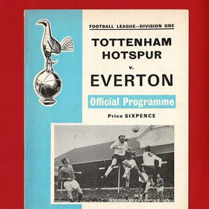 May include: A vintage football program cover featuring the Tottenham Hotspur vs. Everton match. The cover has a light blue background with the team names and "Official Programme" in bold text. A black and white image of a football match is also included.