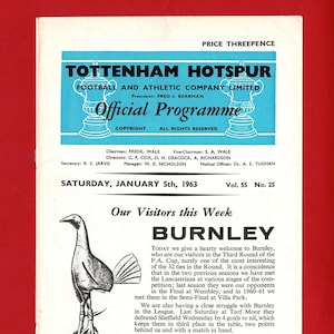 May include: A vintage Tottenham Hotspur football program from January 5, 1963, featuring a black and white illustration of a bird on a ball. The program includes details about the Burnley match and team information.