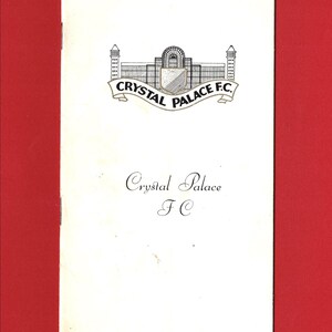 May include: A black and white image of the Crystal Palace Football Club logo. The logo features a building with a crest and the text "Crystal Palace F.C."