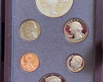 1983 Prestige Set. Featuring Olympic Discus Thrower Silver Dollar.