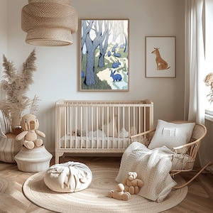 May include: A framed vertical wall art print featuring a stylized forest scene with blue rabbits, dark blue trees with white speckles, and a winding path. The artwork is displayed in a nursery room setting above a wooden crib and a rocking chair.