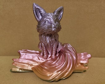 May include: A 3D printed figurine of a fox sitting on a log. The fox is a gradient of pink and purple, and the log is a gradient of pink and orange.