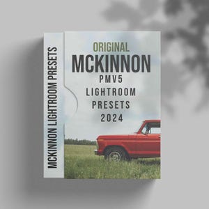 May include: A red truck parked in a field of green grass. The truck has a white bumper and a white license plate. The truck is in front of a white box with the text "ORIGINAL MCKINNON PMV5 LIGHTROOM PRESETS 2024" printed on it.