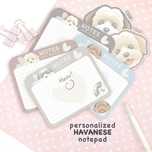 May include: A set of rectangular grid-lined notepads featuring illustrations of Havanese dogs. Each notepad includes the text "NOTES" followed by a name like "Oliver," "Peanut," or "Coco." One notepad displays the handwritten word "Hello!" with a smiley face.