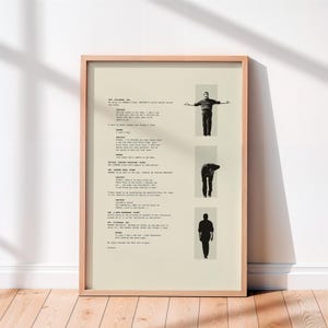 May include: Framed artwork with a beige background, printed text, and three grayscale images of a person in various poses. The artwork is enclosed in a light brown wooden frame.