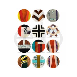 May include: A collection of twelve round decorative objects with various geometric and abstract designs. The objects feature a mix of colors including yellow, orange, brown, black, white, and green. The designs incorporate wood, resin, and other materials.