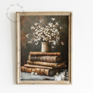 May include: A framed painting of a still life featuring a bouquet of white flowers in a cream-colored vase, resting on a stack of antique books. The background is a dark brown color.