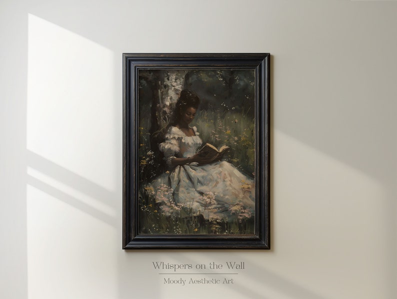 May include: A framed painting of a woman in a white dress sitting in a field of flowers and reading a book. The painting has a dark, moody aesthetic.