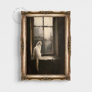May include: A framed painting of a white cat sitting on a windowsill, looking out a window with rain falling outside. The window is framed in white and the cat is looking out at the rain.