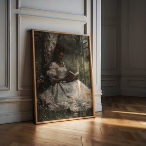 May include: A framed painting of a person sitting in a forest clearing, reading a book. The person is wearing a white dress and has dark skin. The background is a lush green forest with a birch tree.
