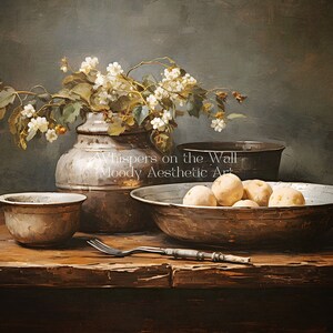 May include: A still life painting depicting a rustic wooden table with a silver bowl filled with potatoes, a silver bowl, a silver pitcher with white flowers, and a fork. The background is a dark green wall with the text "Whispers on the Wall Moody Aesthetic Art".