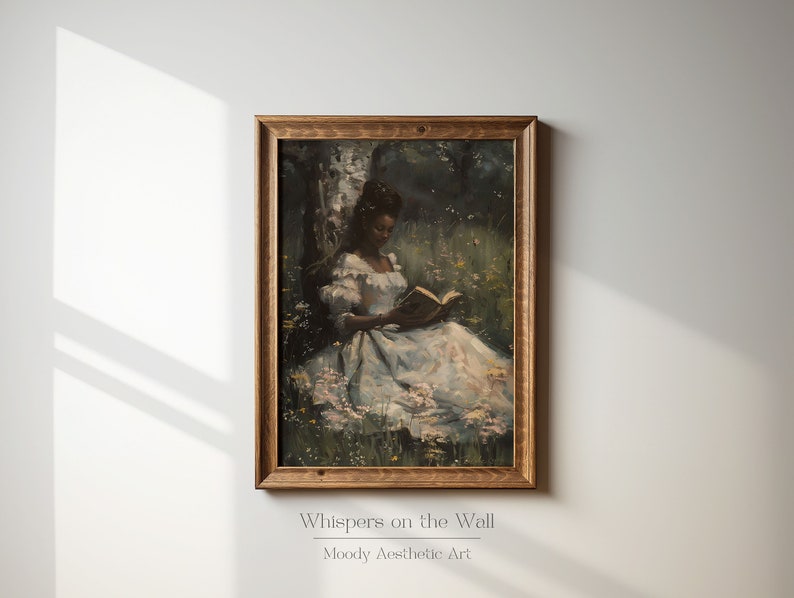 May include: A framed painting of a woman in a white dress sitting in a field of flowers and reading a book. The painting is in a wooden frame and has a vintage aesthetic.