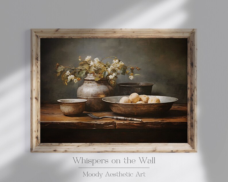May include: A still life painting depicting a wooden table with a bowl of potatoes, a vase of white flowers, and two metal bowls. The painting is framed in a rustic wooden frame. The title "Whispers on the Wall" is written below the painting.