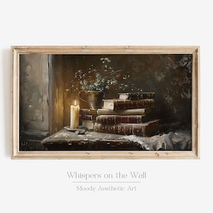 May include: A painting of a still life with a lit candle, a stack of old books, and a vase of flowers in a dimly lit room. The painting is framed in a light wood frame. The title of the painting is "Whispers on the Wall" and the artist is "Moody Aesthetic Art".