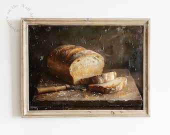 May include: A framed painting of a loaf of bread sliced on a wooden cutting board. The bread is light brown and the cutting board is dark brown. The background is a dark brown color.