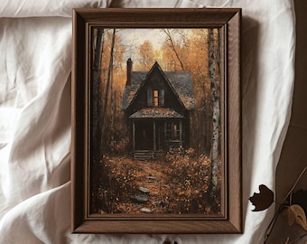 May include: A framed painting of a dark wooden house with a single lit window in the woods. The house is surrounded by trees with fall foliage in shades of orange, yellow, and brown. A stone path leads to the front door.