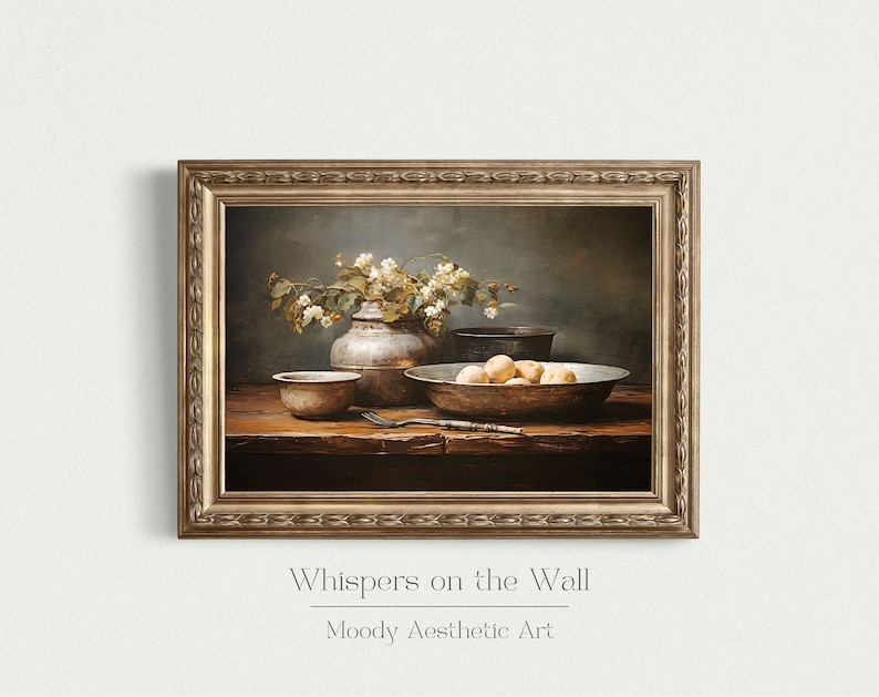 May include: A still life painting depicting a rustic wooden table with a silver vase filled with white flowers, a bowl of fruit, and other silver bowls. The painting is framed in a gold frame and has the text "Whispers on the Wall" and "Moody Aesthetic Art" below the image.