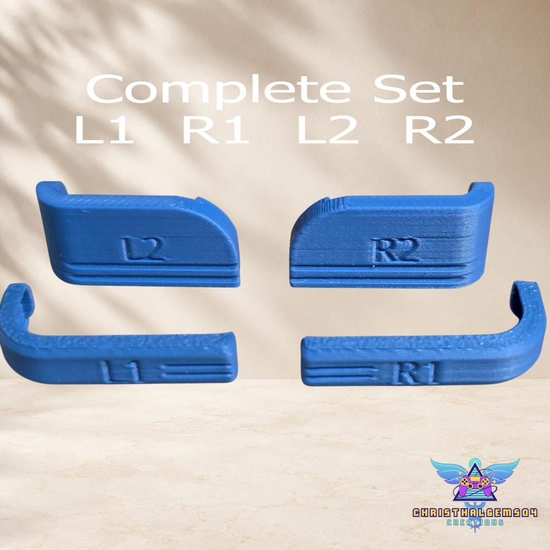 May include: A complete set of four blue controller shoulder buttons labeled L1, R1, L2, and R2. The text Complete Set L1 R1 L2 R2 is visible above the buttons, and the logo for Christhalgems04 Creations is in the bottom right corner.