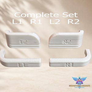 May include: A complete set of four white replacement controller shoulder buttons labeled L1, R1, L2, and R2. The components feature a textured, layered finish consistent with 3D printing, with the text Complete Set L1 R1 L2 R2 visible above.