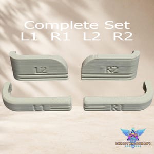 May include: A complete set of four light gray 3D-printed controller shoulder buttons labeled L1, R1, L2, and R2. The components feature a textured surface with embossed lettering and curved edges, designed for gaming controller customization and replacement.