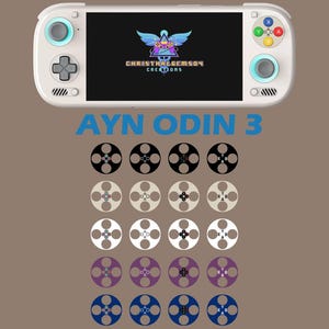 Könnte beinhalten: Eine weiße AYN ODIN 3 Handheld-Spielkonsole mit einem Bildschirm, der ein Logo anzeigt. Unter der Konsole befinden sich Reihen farbenfroher Rollen-Designs. Der Text "CHRISTHALGEMSON CREATIONS" ist auf dem Bildschirm zu sehen.