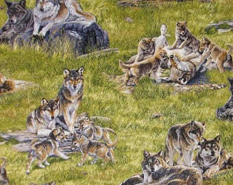May include: A fabric pattern featuring multiple wolves in various poses, set against a backdrop of green grass and rocks. The wolves display shades of brown, gray, and white, creating a naturalistic scene. The design includes both adult wolves and playful pups.