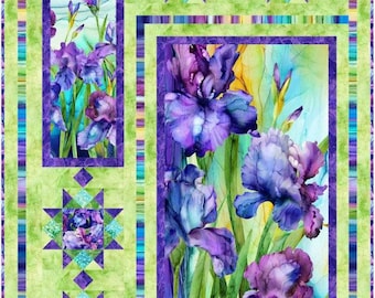 May include: A floral quilt featuring vibrant purple iris blooms against a watercolor background. The quilt has a green and purple border with star-shaped accents. The design includes rectangular and square panels with floral imagery, creating a visually appealing textile.