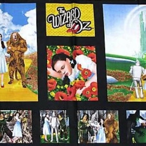 May include: A multi-panel fabric featuring scenes from the Wizard of Oz. The panels show Dorothy, the Scarecrow, the Tin Man, and the Cowardly Lion walking down the yellow brick road, Dorothy sleeping in a field of poppies, and the characters walking towards the Emerald City.