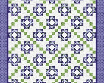 May include: A quilt pattern with a white background and a repeating pattern of green and purple squares. The squares are arranged in a diagonal pattern, creating a diamond shape.