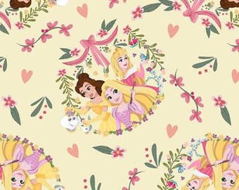 May include: A repeating pattern featuring three animated princesses surrounded by floral wreaths, pink bows, and hearts on a light yellow background. The princesses are in yellow, pink, and brown dresses. The design includes small white dogs.