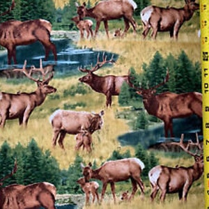 May include: A fabric print featuring a repeating pattern of brown and tan elk in a forest setting. The elk are standing in a grassy field with green trees and a blue stream in the background.