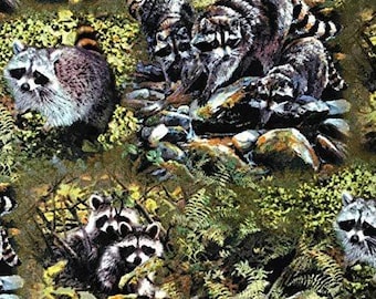 May include: A repeating fabric design showing several raccoons amongst ferns and rocks. The raccoons have distinctive black and white markings and striped tails. The colour palette is dominated by greens, browns, and greys, creating a woodland scene.