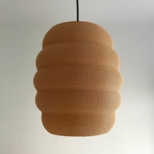 May include: A brown, textured, round pendant light fixture with a black cord.